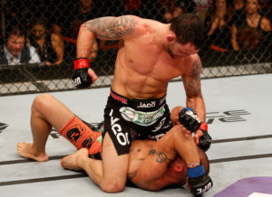 AUSTIN, TX - NOVEMBER 22: (L-R) Frankie Edgar punches Cub Swanson in their featherweight bout during the UFC Fight Night event at The Frank Erwin Center on November 22, 2014 in Austin, Texas. (Photo by Josh Hedges/Zuffa LLC/Zuffa LLC via Getty Images)